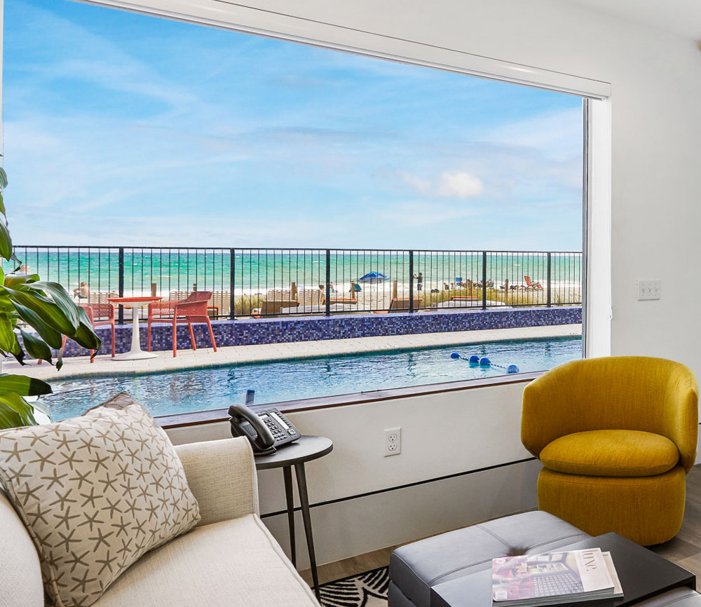 Bedroom with view of pool